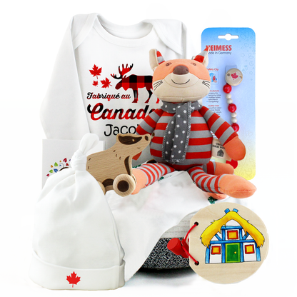 Baby gift basket with Canadian-themed design, plush toy, baby clothing, and wooden toy 